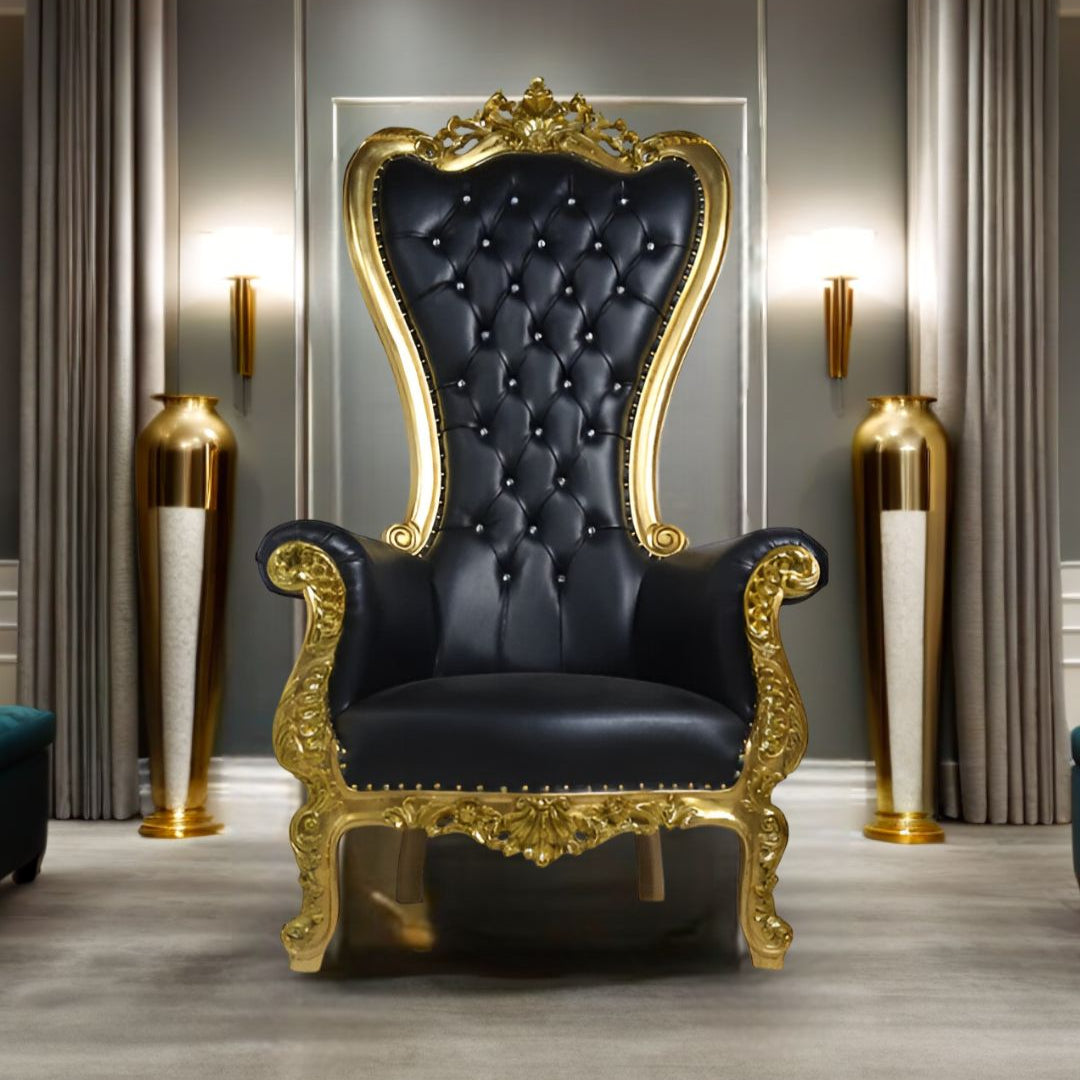 Close-up of intricate carvings on Black & Gold Throne Chair's frame and plush seat.